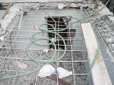 Reinforced concrete floor being removed