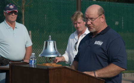 Sheldon Gregg reads name on the monument.