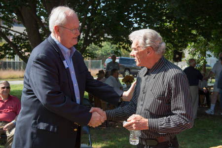 Chester Eagles - 49 years receives a service award pin from Charles L. (Skip) Huston III