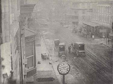 Main Street, looking west toward First Avenue and the Brandywine.  The large building with the two-story porch and the Mansard roof is the Speakman House, a familiar landmark for many years.