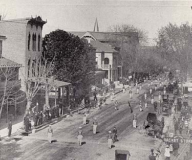 Parade on Main Street Parade on Main Street, 1889. In this view are visible the handsome Chester County Mutual Insurance Building, the Odd Fellow's Hall, and the tip of the steeple of the Episcopal Church of the Trinity.
