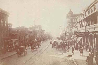 Main Street, looking west.  The Stephenson House, later the Grand Hotel, appears at right foreground.