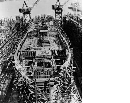 Complete the lower deck and begin building  the upper deck midship.